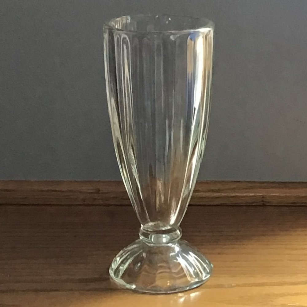 Small bunch vase with vertical grooves.